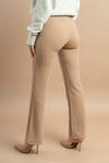 Neutral-toned cream trousers with a wide-leg design