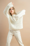 Stylish women’s white rhinestone sweater, perfect for winter