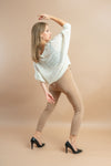 Women's oversized white sweater with trendy batwing sleeves for fall and winter