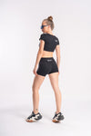 Sporty outfit with black crop top and shorts for women