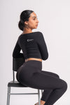 black seamless leggings with matching long-sleeve cropped top, nylon spandex activewear