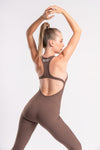 Backless brown workout jumpsuit for women, designed for flexibility and support