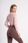 Cropped sweater top with intricate knitting in pink color