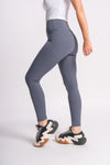 woman wearing grey color active wear yoga pants perfect for yoga sessions