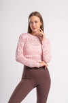 Chic knit cropped top featuring delicate patterns and texture