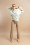 Elegant cream wide-leg trousers with a soft, draping fabric