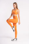 Orange color yoga pants and sports bra set suitable for gym wear